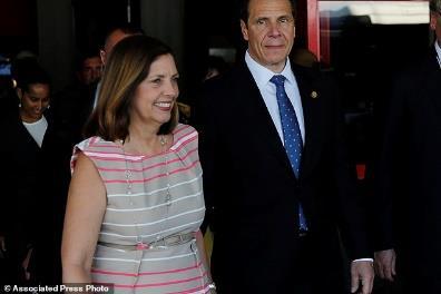 Meeting: New York Governor Andrew Cuomo, center, shakes hands with Cuba's Minister of Foreign Trade Rodrigo Malmierca at the Hotel Nacional in Havana Checking the engine: Cuomo smiles after seeing a