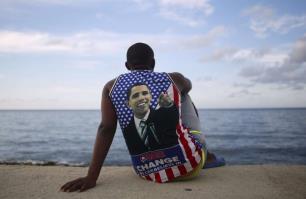 Medical student Electo Rossel, 20 years old, wearing a shirt with a photo of President Barack Obama, listens to music at the Malecon seafront next to the U.S. embassy in Havana, Cuba.