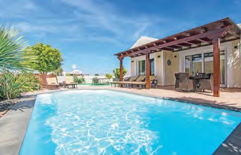 CANARY ISLANDS, LANZAROTE VILLA AMARILLO PLAYA BLANCA Fantastically furnished and only a stone s throw from the lively centre of Playa Blanca, Villa Amarillo stands out.
