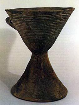 The plain chalice is an example of Pyrgos ware, one of the earliest forms of Cretan pottery.