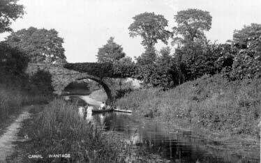 Wilts & Berks Canal - view of Hunters (?) bridge; looking north; c1900 - with lady and dog in rowboat. (TR004) PLEASE NOTE.