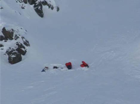Figure 1: One row of four dummies placed in the avalanche slope. The order of the safety equipment was changed each time.
