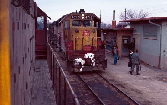 Eldon, as well as Eldon to St Louis. Below - A week later, 3 GP40s and a geep bring train #73 to a stop at the Eldon depot for a crew change on March 22, 1975.