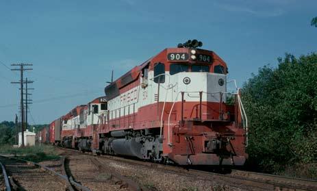 (Larry Thomas) Right - Before the Mandarin Orange and white of the 1970s, Frisco freight power wore black with yellow stripes, as illustrated by Alco FA #5209 as it leads an Extra freight