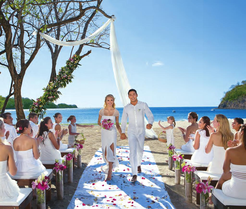Down the Isle WHETHER YOU WALK TOGETHER ON A PETAL-STREWN BEACH OR AT