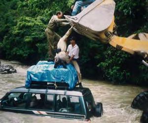 Several times the weight of the equipment on the roof nearly tipped the vehicle on its side. Doug Marsh watched the swirling waters come toward him.