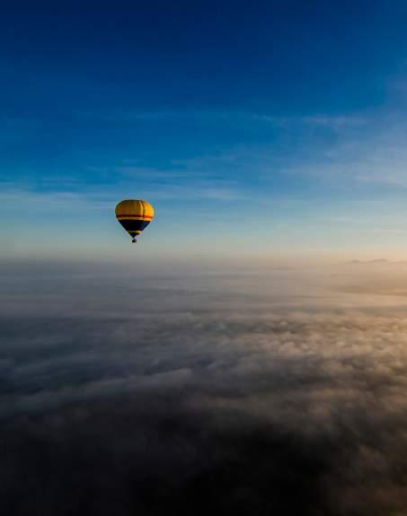 Day 4 Rise and shine by watching the sun come up over the Atherton Tablelands in a hot air balloon.