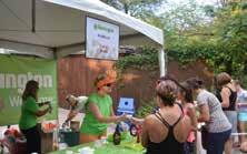 Attendees visit corporate-sponsored scooping stations to sample flavors of ice cream and