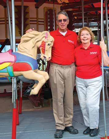 42 m o u n t a i n d i s c o v e r i e s Tom and Sara Kuhn, owners of Funland, on the outdoor carousel.