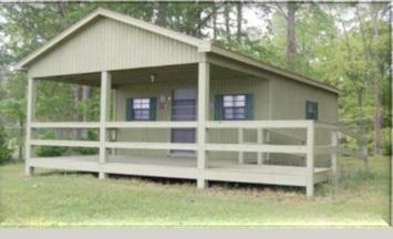CAMP HARDEE FACILITIES Cabin One: Hardee Hotel - Capacity 8 This cabin includes four sets of bunk beds with mattresses. It has a wall HVAC unit for year round camping.