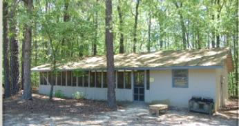 It is a great place for large groups to check in campers and can also accommodate some of your larger group activities. The kitchen area has a refrigerator, two non-commercial stoves, and sinks.