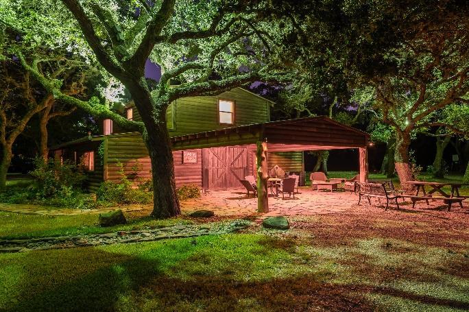 Nestled under a canopy of 100 year old trees, two amazing log cabin homes.