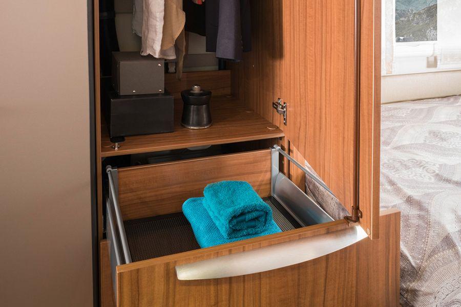 The spacious wardrobe contains a drying drawer which can be used to dry