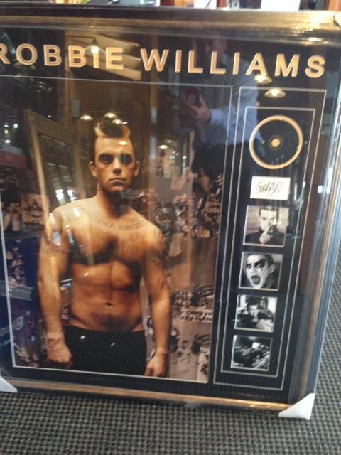 Robbie Williams framed photos,