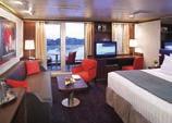 These staterooms feature a sitting area, private verandah, and floor-to-ceiling windows.