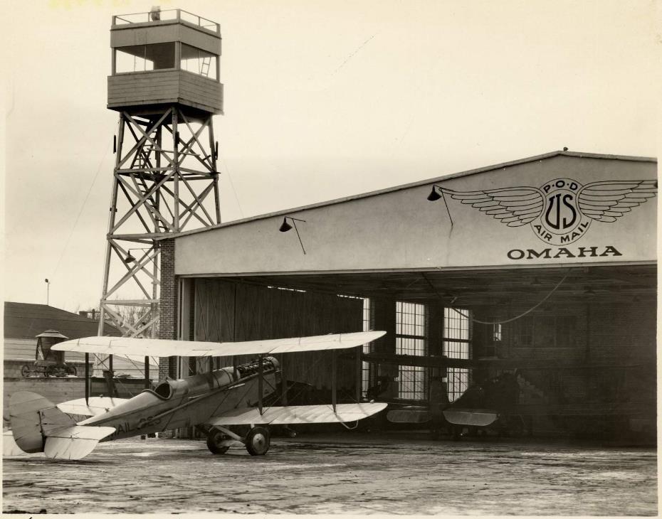 Top: DH-4 mail plane sits in front of the airmail hangar at Offutt Field near Omaha, Nebraska, on January 3, 1925.