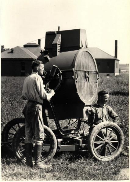 Courtesy National Air and Space Museum Bottom left: Airmail mechanics Carlton Force (standing) and James King pose with a mobile flood light near Omaha around July 1923.