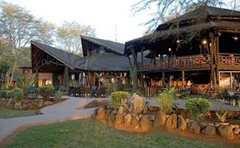 The main lodge at the center of camp hosts an indoor restaurant, bar and library with Internet access to keep the relatives up to date with safari adventures.
