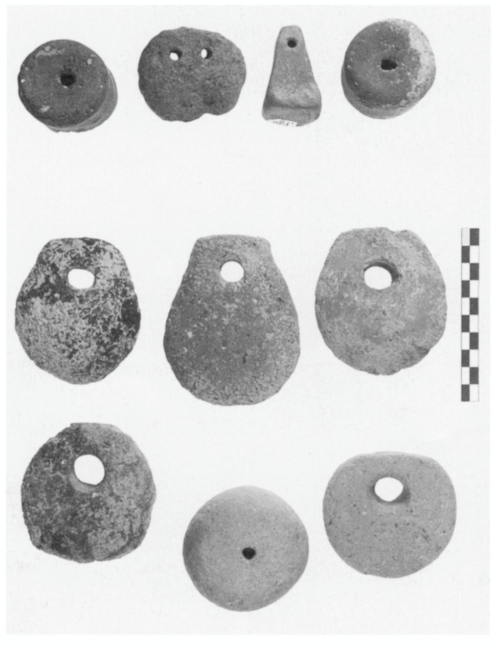 47O CHERYL R. FLOYD AND PHILIP P. BETANCOURT Figure 6. Clay weights from the site included whole and broken weights (Fig.
