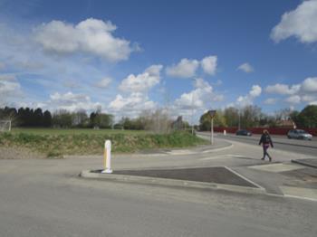 It can be widened by widening into the highway verge and adding a new bridge over the drain near the path junction point, but widening over the Granta