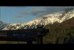 Clip #: 158 4169 British Columbia: Bella Coola Valley: Static signage shot of Bella Coola with mountains and