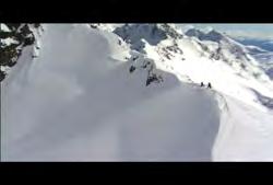 00:00:10:27 N Clip #: 161 4169 British Columbia: Ground low angle shot of young man carrying skis on top of