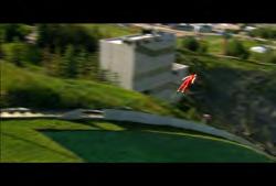 Park: Ski jumper going down practice mountain towards camera 01:30:15:13 N