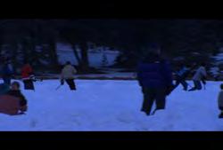 Hotel: Group of men playing outdoor hockey on lake (Winter) 01:51:51:23 N 01:52:10:16 N