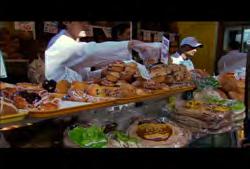 Lawrence Market: Medium wide shot of deli/meat stand inside market 02:05:26:06 N
