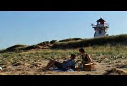 Edward Island: Static shot of lighthouse on grassy hill during sunset 02:35:19:12 N 02:35:25:13 N