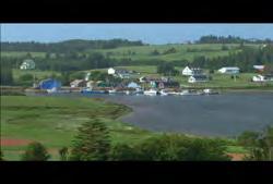 00:00:05:03 N Clip #: 559 PE-HD-001 Prince Edward Island: Static wide shot of town on edge of water