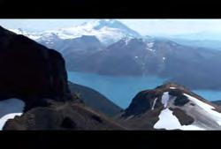 of mountain climber on top of peak Clip #: 053 01:09:30:17 N 01:09:40:02 N 00:00:09:15 N BC-HD-001 British Columbia: Coast Mountains: