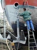 Bonne Shipyard (Belgium) Pictures showing the application of Zinga by roller to the blasted hull of a typical fishing vessel.