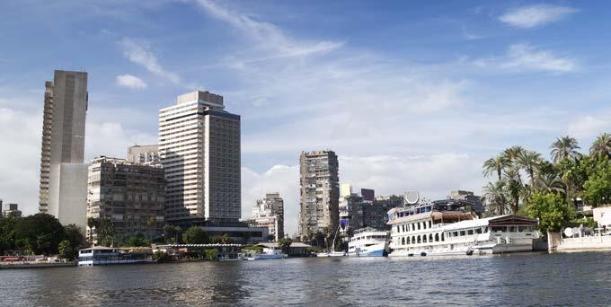 Many farmers along the Nile use animals such as donkeys to help them carry crops and supplies. Western-style hotels and other modern buildings line the banks of the Nile in Cairo.
