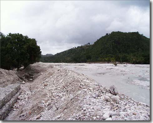 This photo, taken two weeks before the floods, shows the dyke construction (on the left) designed to keep the