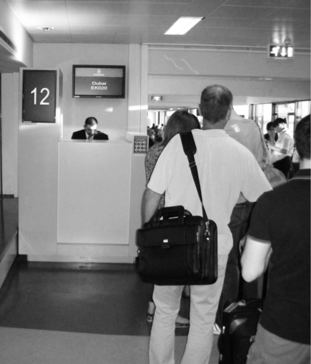 2 1 Refer to Photograph A, taken by an international traveller waiting to board an Emirates flight from Manchester to Dubai.