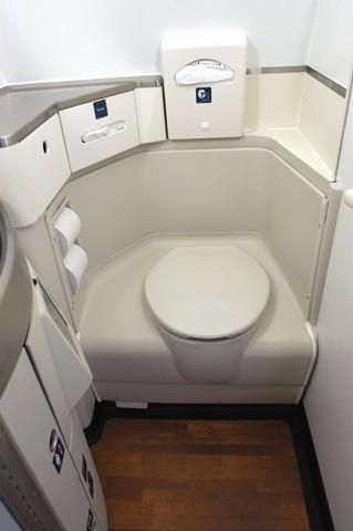 This is a picture of the new and improved front cabin of a Delta Airliner This is a picture of a seat in the main cabin of