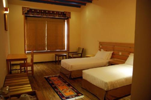 Each room is heated and features wifi, an inroom safe, and tasteful Bhutanese furnishings.