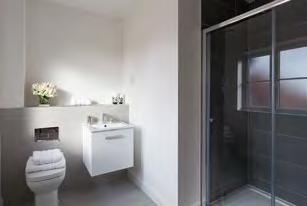 complimenting cabinets & laminate work surface, with space for a free standing washing machine and tumble dryer Bathroom, Ensuite and Cloakroom Contemporary white sanitary ware with chrome fittings