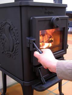 After the paper/fire lighters have caught fire, leave the fire door ajar about 2-3 cm, so that the chimney draws well.