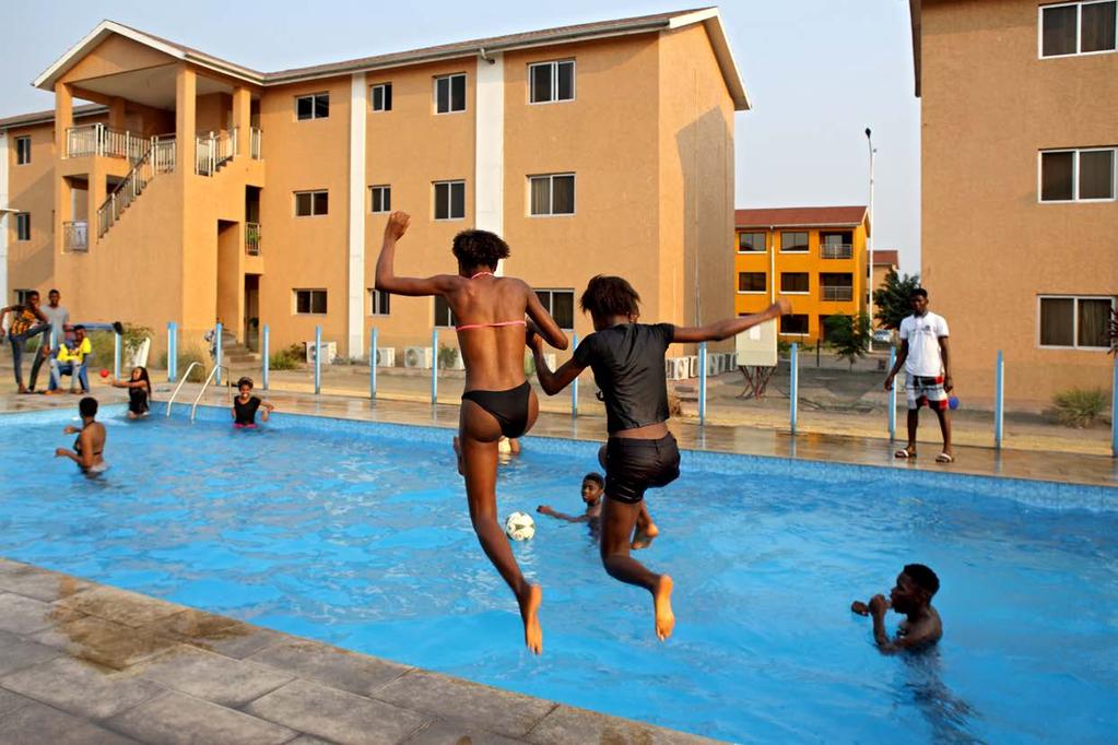 Youth from the wealthy Kinshasa in the pool of the Cité du Fleuve, a residential neighbourhood