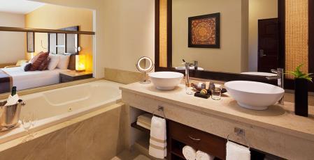 Jacuzzi Junior Suite Romantically decorated suites in a blend of contemporary and authentic Mexican style features a balcony or terrace, relaxing Jacuzzi, a marble top bathroom with double sinks,