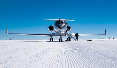 The Gulfstream G550 jet alongside the DC3 Basler ski-equipped aircraft.