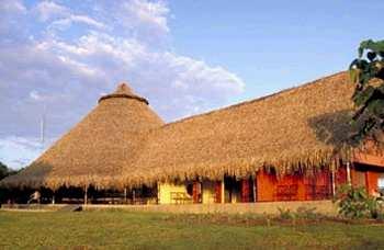 The round palenques (or ranchos) are covered by a traditional thatched roof of palm leaves.
