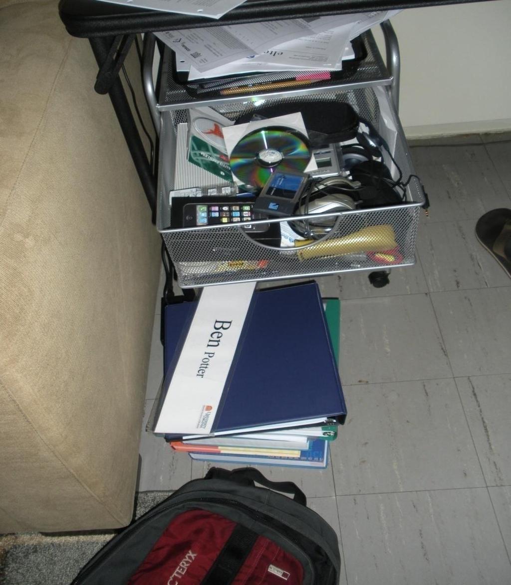 THE STORAGE SPACE Unused junk in drawer to be filed tray never gets filed Case books on floor