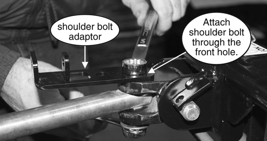 Slide both of the support tubes through the center of the Tow Defender and into the sleeve at the edge of the screen (Figure 7), so that the hole and the push-button lock are at the center.