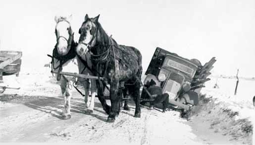 A Bit of Rough Going Wintertime in Montana. Early 1934. Hauling material on the roads around the dam site. These words might still make grown men shudder.