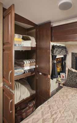 The deep bedroom slide-out provides ample walk space at the foot of the bed while the arched roof provides up to 6 8 interior