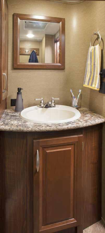 The Montana Mountaineer bathroom feels like home with the 48 long by 30 wide seamless fiberglass shower with molded seat and glass doors in 6 floor