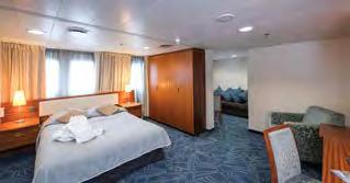 CATEGORY 10 SUITE Deck seven: forward-facing picture windows, unobstructed view; matrimonial bed,